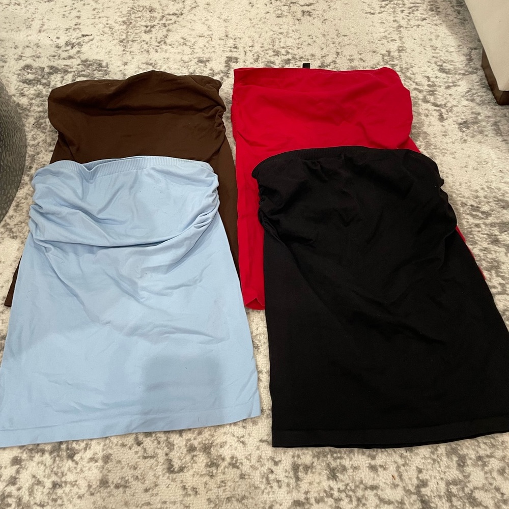 Set of 4 BEBE strapless halter tops.